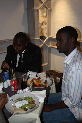 unk_2010_delegates talk over lunch.JPG